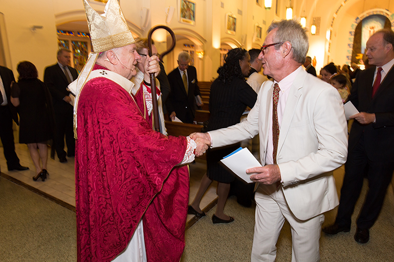 Archbishop Thomas Wenski greets local lawyers, judges and other legal professionals at the 27th annual Red Mass for the St. Thomas More Society of South Florida, celebrated June 9 at St. Anthony Church in Fort Lauderdale.