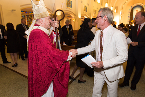 Archbishop Thomas Wenski greets local lawyers, judges and other legal professionals at the 27th annual Red Mass for the St. Thomas More Society of South Florida, celebrated June 9 at St. Anthony Church in Fort Lauderdale.
