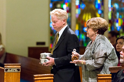 Thomas Jordan and Patsy DiGuilian take up the offertory gifts during the annual Red Mass celebrated June 9 at St. Anthony Church in Fort Lauderdale. Local lawyers, judges and other legal professionals were on hand.