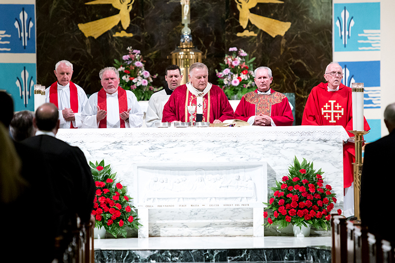 Archbishop Thomas Wenski presides at the 27th annual Red Mass for the St. Thomas More Society of South Florida, celebrated June 9 at St. Anthony Church in Fort Lauderdale. Priests who concelebrated included, from left: Msgr. Vincent Kelly of St. John the Baptist, Father Curtis Kiddy of St. Jerome, Father Michael Grady of St. Anthony and Father Anthony Mulderry of St. Gabriel.