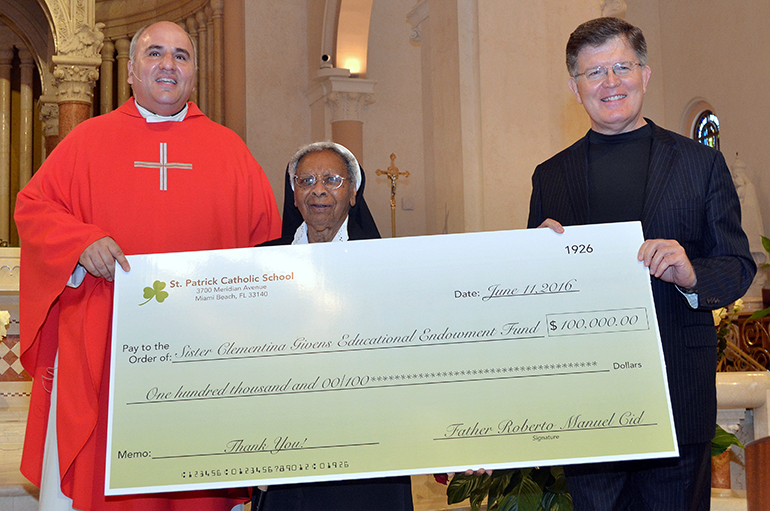 Father Roberto Cid, St. Patrick's pastor, announces the new Sister Clementina Givens Educational Endowment Fund, with seed money of $ 100,000. At right is Steve Wilson, treasurer at St. Patrick.