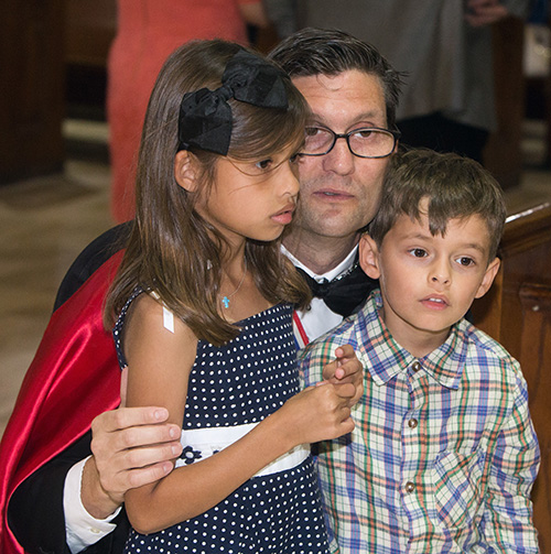 Knight of Columbus Daniel Biggs, III, brings his children, Victoria Biggs, 7, and Daniel Biggs, IV, to see the relics of St. John Fisher and St. Thomas More.