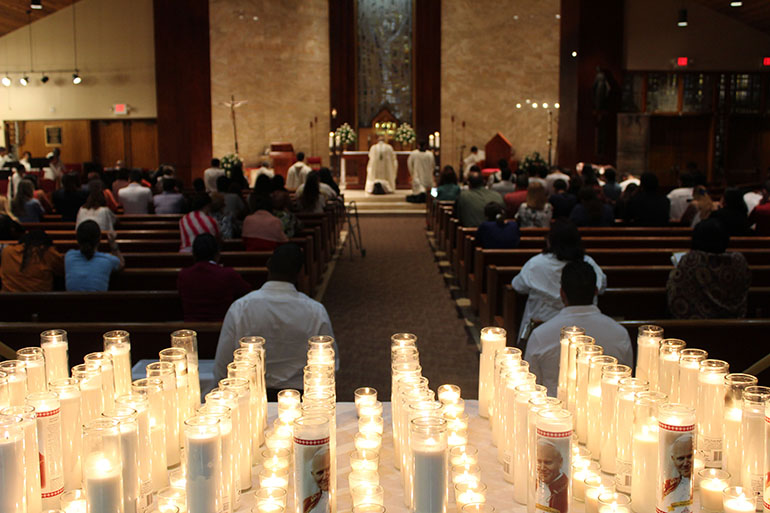 Participants at Illuminare La Notte placed these candles before the Blessed Sacrament.