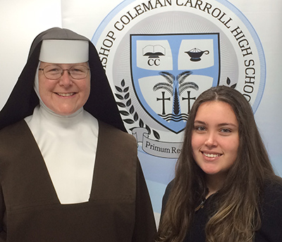 Carmelite Sister Margaret Ann, principal of Archbishop Coleman Carroll High School, poses with senior Michelle Rios, the school's second recipient of a Gates Millennium Scholarship.