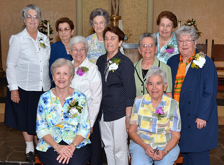 Sisters and former Sisters of St. Philip Neri who have taught at St. Jerome pose for a group photo. Top row: Sister Paulina Montejo, former sister Maria Nieves Alvarez, Sister Maria Cartaya, former sister Mercedes Fuentefrias. Middle row, from left: Sister Maria Victoria Ortega, Sister Lourdes Gross, Sister Nilda Garcia, Sister Vivian Gomez. Front row: former sister Eugenia Bulnes, Sister Ofelia Roibas.