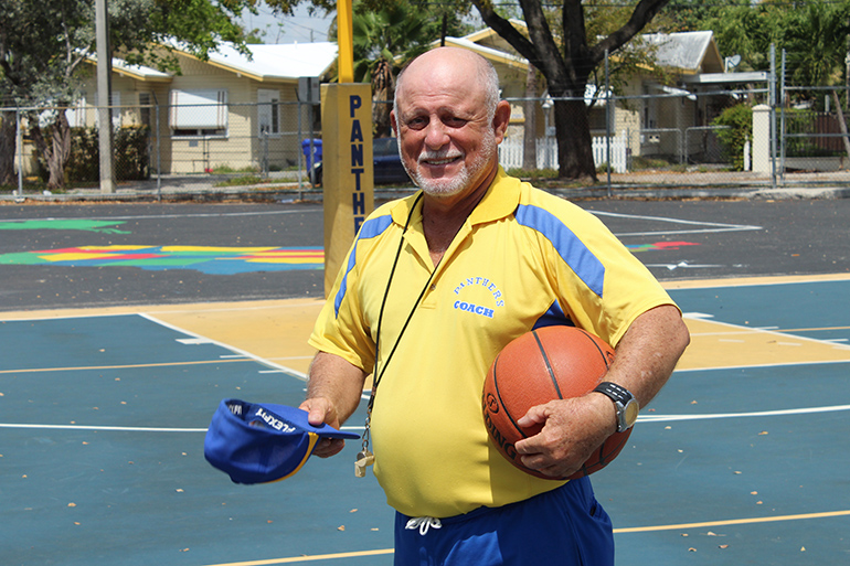 March 18, 2016
MIAMI

Hats off to the coach: Sts. Peter and Paul School's Coach William Oharriz gets ready for the start of a basketball game honoring his retirement. Coach Oharriz has been a part of the Sts. Peter and Paul family for 46 years.