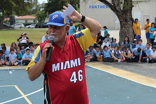March 18, 2016
MIAMI

Coach William Oharriz could not wait to get his personalized Miami Heat jersey on. He thanked faculty and students for his unforgettable 46 years of coaching at Sts. Peter and Paul.