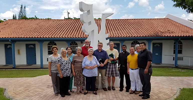 Participants in SEPI's Immersion in Spanish Language and Culture program pose in a courtyard of the Southeast Pastoral Institute in Miami.