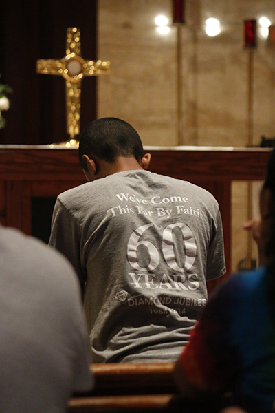 World Youth Day pilgrims from South Florida, including one of two teens from St. Philip Neri Parish in Miami, take part in adoration at St. Martha Church.