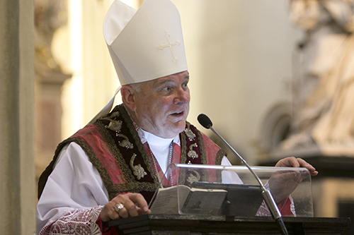 Archbishop Thomas Wenski preaches the homily during Mass for Miami pilgrims at St. Anne Church in Old Town Krakow.