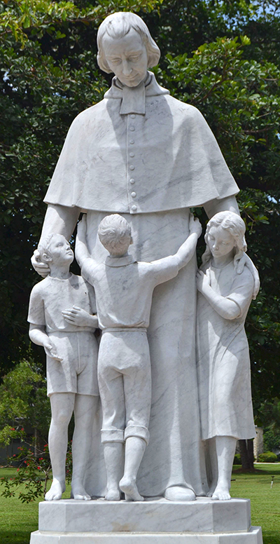 Statue of the 19th century St. Joseph Benedict Cottolengo stands in the 50-acre campus of the Marian Center.