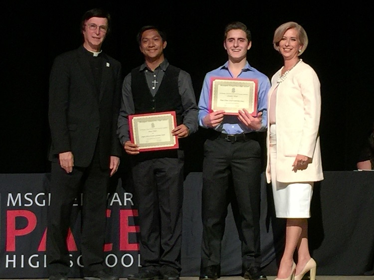 Monsignor Edward Pace High School students Keanu Orfano and Alexander Pereda (second and third from left) pose for a photo with Pace President Fr. Paul Vuturo and Pace Principal Ana Garcia at the 2016 Pace Academic Awards and hold certificates honoring their selection to attend the HOBY Leadership Seminar