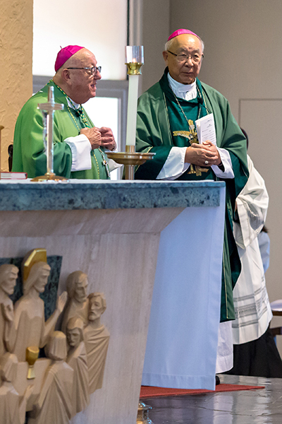 Miami Archbishop Emeritus John C. Favalora and Auxiliary Bishop Emeritus Ignatius Wang of San Francisco preside at an Aug. 14 Mass marking the 20th anniversary of the Chinese Apostolate of the Archdiocese of Miami.