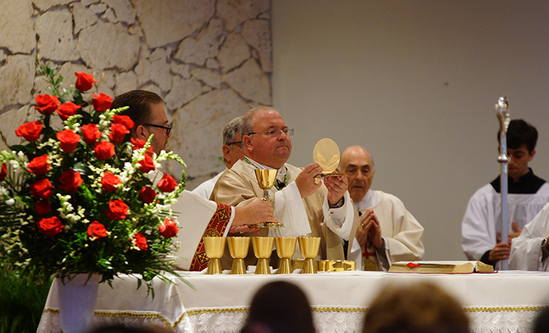 Miami Auxiliary Bishop Peter Baldacchino celebrates Mass  at St. Maxiimilian Kolbe Parish in Pembroke Pines on the 75th anniversary of the saint's death in Auschwitz.