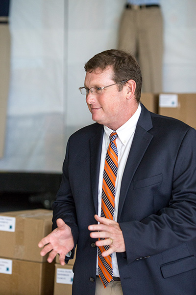 Douglas Romanik, principal and development director at Archbishop Curley Notre Dame Prep, was on hand during an Aug. 16 distribution of donated school uniforms at the Miami archdiocesan middle and high school.