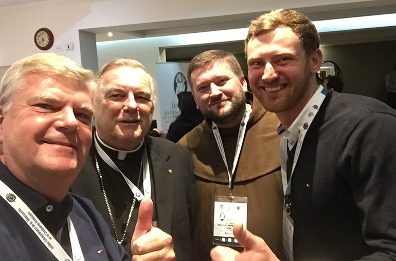 Polish connections in Bogota: Archbishop Thomas Wenski poses for a selfie with, from left: Ricardo Grzona, an Argentinian of Polish descent now living in Miami and working as director of the Ramon Pane Foundation, which promotes the use of Lectio Divina in parishes and families; a Polish Franciscan working in La Paz, Bolivia; and a Polish seminarian with the Neocatechumenal Way who studies in Bogota.