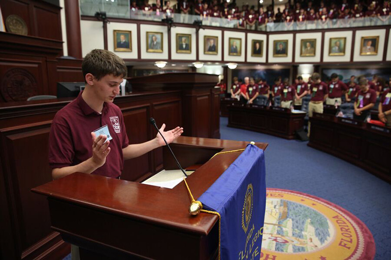 St. Thomas Aquinas student Colin Apruzzese leads the prayer at one of the opening sessions of Boys State, held in Tallahassee at the end of June.