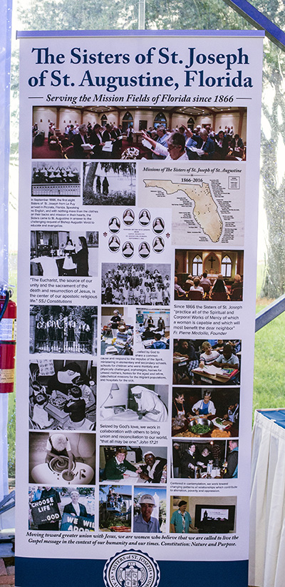 A banner at the event shows what the Sisters of St. Joseph have done and continue to do in Miami.