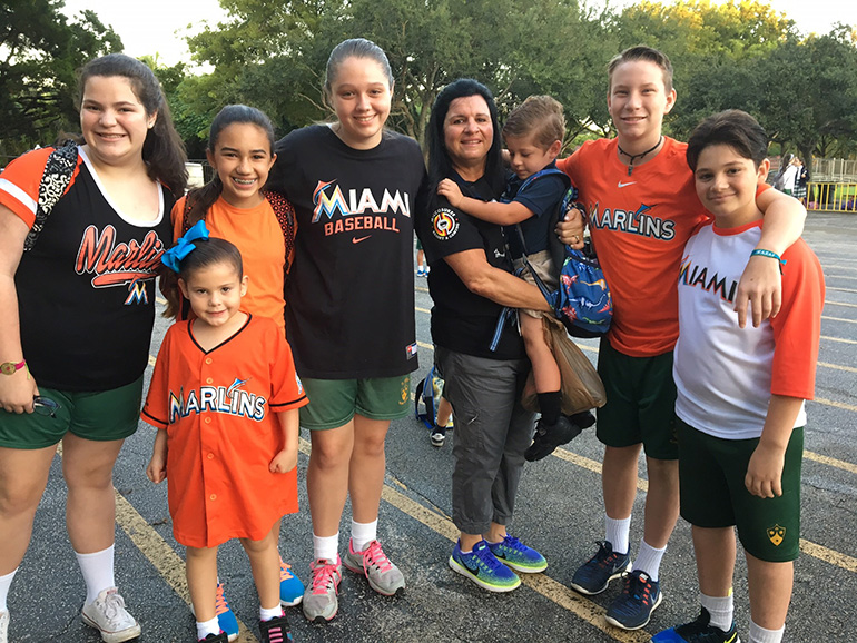 St. Theresa students dress in Marlins colors to honor Jose Fernandez, Eduardo Rivero and Emilio Macias. From left: Sofia Farres, Sophia Cuadrado, Isabella Arechavaleta, Isabella Motola, Ana Cairo, Danny Serrano, Brian Logan and Daniel Muriedas.