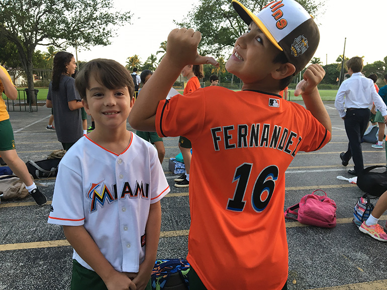 St. Theresa students Nico Espinosa and Tyler Rodriguez proudly wear #16 in memory of Jose Fernandez.
St. Theresa School dedicated its morning prayer and reflection Sept. 28 to Jose Fernandez, 24, pitcher of the Marlins baseball team, and his two friends, Miami residents Emilio Macias, 27, and Eduardo Rivero, 25.