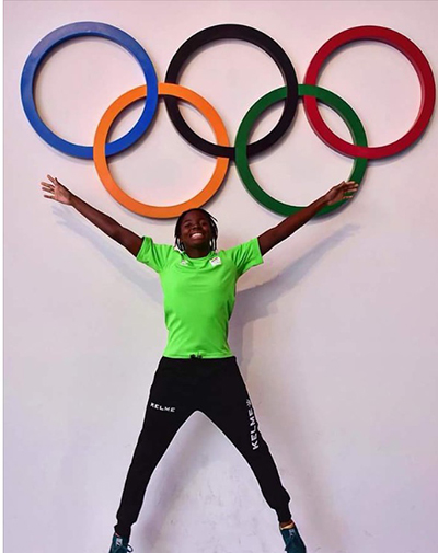 St. Brendan High alumnae Evita Leter poses in front of the Olympic rings in Rio, where she competed for her native Suriname.