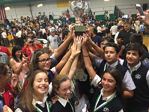 St. Brendan Elementary School students celebrate their second straight win among large division schools in St. Brendan High School's Academic Olympics.