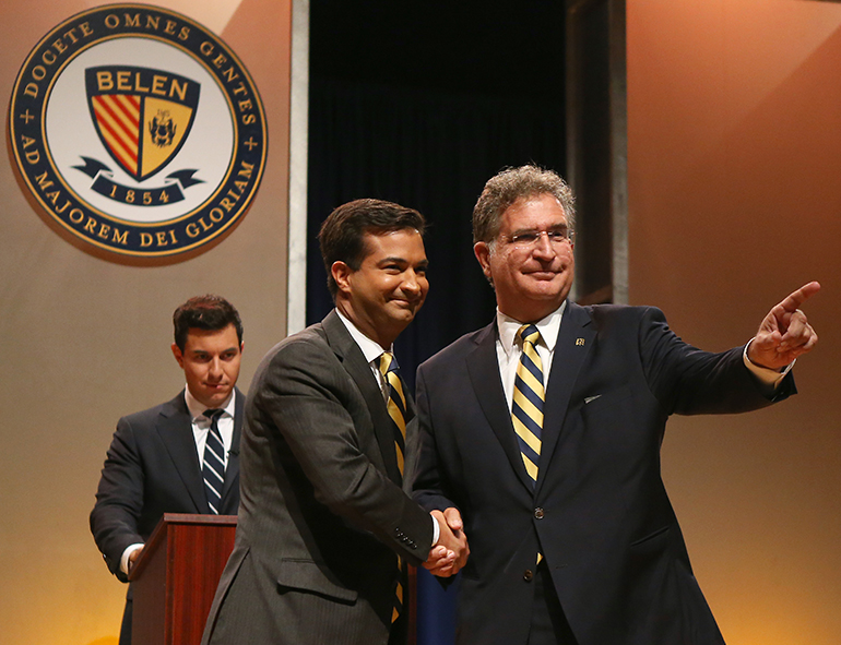 US Representative Carlos Curbelo (R-Fla), left, shakes hands with his opponent, Democrat challenger Jose Garcia, before the start of the debate at their alma mater, Belen Jesuit Preparatory School in Miami.