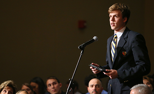 Belen student Patrick Maher asks a question to U.S. Representative Carlos Curbelo and Democrat challenger Jose Garcia.