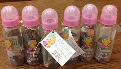 View of some of the baby bottles filled with coins and currently donated by St. Bonaventure School students to benefit Respect Life Ministry.
