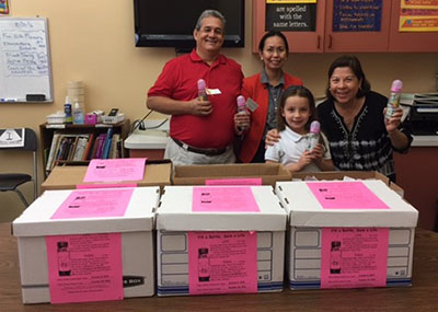 St. Bonaventure first grader Danika Talbert, who donated her tooth fairy money to the baby bottle campaign, poses with Joseph and Ximena Terneus, far left and right, respect life representatives for the parish. Also with them is St. Bonaventure resource teacher and National Junior Honor Society advisor, Stella DiBattista.