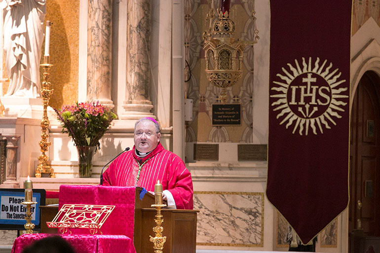 Auxiliary Bishop Peter Baldacchino delivers his homily to members of the Miami Catholic Lawyers Guild gathered at Gesu Church Oct. 26 for their annual Red Mass.