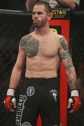 Picture of Deacon John Clarke from his days as a professional fighter with Strikeforce Miami in 2010. “I stopped fighting Professional Mixed Martial Arts when my wife, Dawn, asked me to because of the kids,” he said, adding “happy wife equals happy life.”