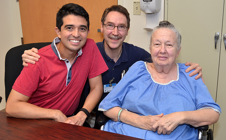 Physical therapist assistant Randal Koerner, center, buddies up with two patients at St. Catherine's Rehabilitation Hospital in North Miami. From left are Fernando Pacheco and Judy Winters.