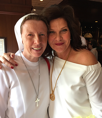 Sister Lidia Valli, executive director and principal of the Marian Center, poses with Toni Acocella, chair of the "Claws for Celebration" event at Joe's Stone Crab and member of the Marian Center Auxiliary.