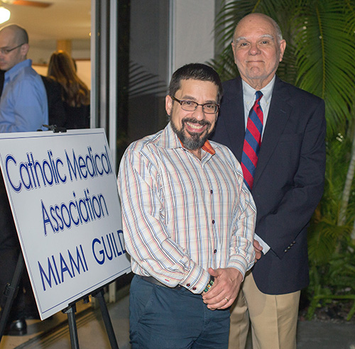 Posing for a photo after the White Mass Nov. 13, from left: Dr. Felix Rodriguez, president of the Catholic Medical Association in Palm Beach; and Dr. Felipe Vizcarrondo, president of the Miami Guild.