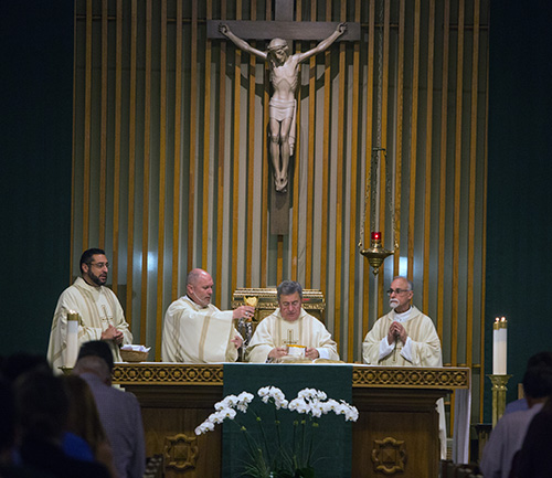 Celebrating the White Mass at St. Augustine Church in Coral Gables Nov. 13, from left: Father Robert Ayala, parochial vicar at St. Augustine; transitional Deacon Alexis Ibarra; Msgr. Tomas Marin, pastor of St. Augustine and a medical doctor himself; and Father Alfred Cioffi, St. Thomas University bioethics professor and chaplain of the Miami Guild of the Catholic Medical Association.