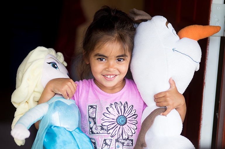 Three-year-old Sierra was living temporarily at New Life Family Center, a Catholic Charities-sponsored motel-style residence providing a safe environment for 15 families while they get back on their feet. Children are the central focus of New Life.