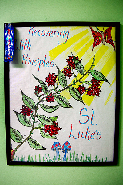 A resident-created artwork hangs on a wall at Miami Catholic Charities' St. Luke's Center.