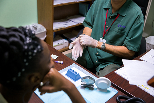 Raul Gonzalez, outreach case manager, handles HIV and Hepatitis C testing at Miami Catholic Charities' St. Luke's Center.