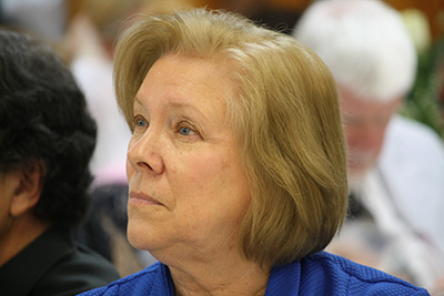 Joan Crown, archdiocesan director of Respect Life, listens attentively to keynote speaker Father Stephen Imbarrato  during the 25th annual Mary for Life Banquet held at St. Malachy Church Dec. 8.