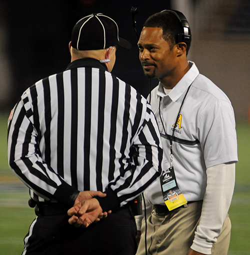 St. Thomas Aquinas head coach Roger Harriott enters into discussion with the side judge in the first half of St. Thomas Aquinas' 46-7 victory over Tampa Plant Dec. 9 in the Class 7A state football championship game at Camping World Stadium. Harriott led St. Thomas Aquinas to its 10th state title, the second in Harriott's tenure with the Raiders.