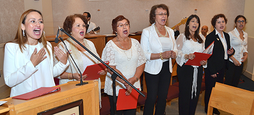 Choir from Our Lady of the Lakes Parish, Miami Lakes, sings at the 70th anniversary Mass for St. Thomas University.