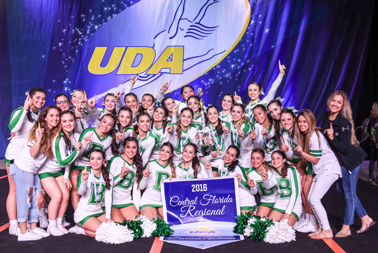 St. Brendan High Varsity Cheerleaders and coaches pose with their first place trophy at the Universal Cheerleaders Association at the Central Florida Regional held Dec. 3.