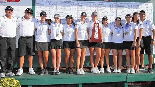 The Lady Mavericks of Archbishop Edward McCarthy High School pose after winning their second consecutive state golf championship.