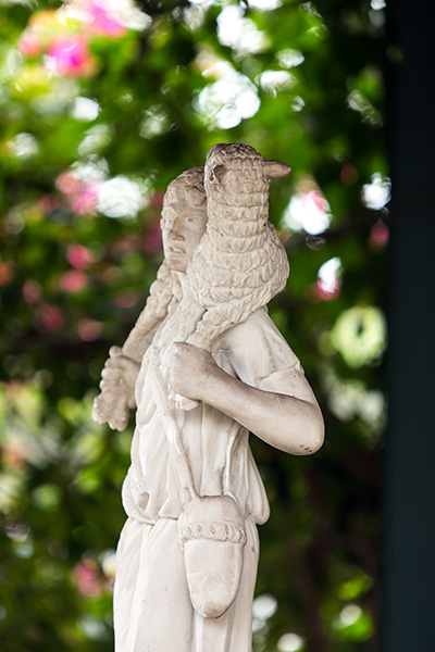 The parish hall at Our Lady of Mercy Church in Deerfield Beach includes a gazebo with a statue of the Good Shepherd.
