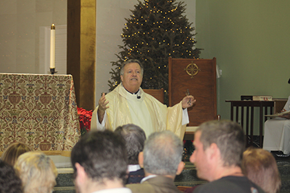 Father Juan Sosa, fifth and current pastor of St. Joseph, celebrates Sunday Mass.