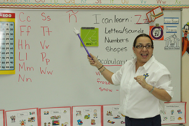 PreK4 teacher Magaly Cunill gets into Spanish vocabulary and phonetics with her students who are learning in both English and Spanish across all class subjects.