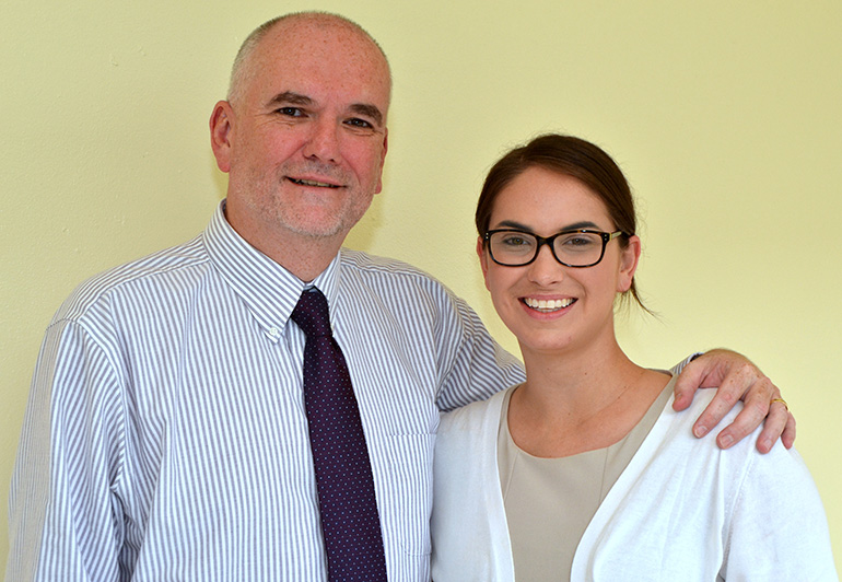 Guiding the Faith in Action Program at St. Thomas Aquinas High School are theology teachers Ian Robertson and Jane Curry.