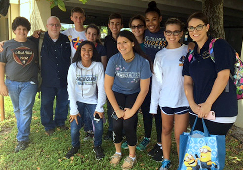 Students and teachers from St. Thomas Aquinas High School spent Sept. 3, 2016, helping out at the Missionaries of Charity shelter and soup kitchen in Miami, doing everything from cleaning to serving food to listening to the stories of the people who get help there.