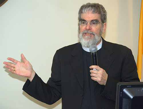 Jesuit Brother Guy Joseph Consolmagno, director of the Vatican Observatory, addresses a luncheon at Belen Jesuit Preparatory School.